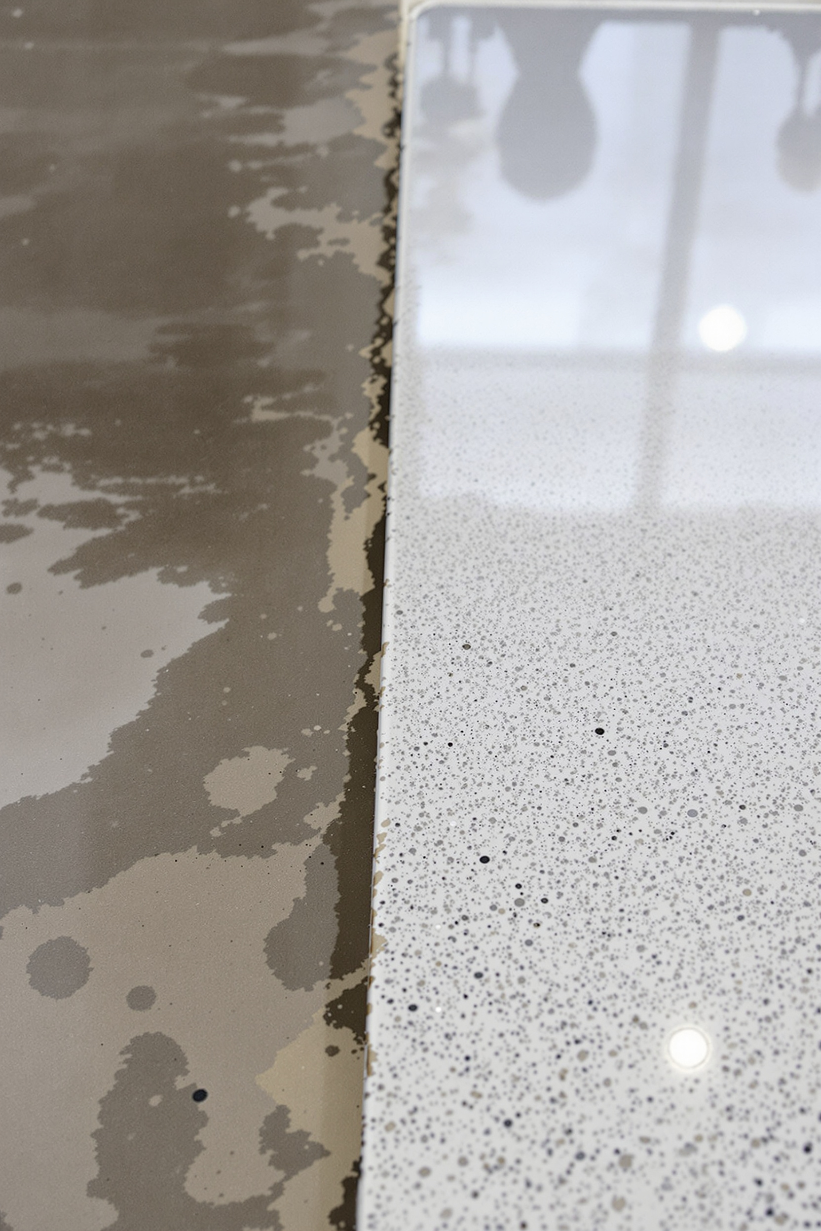 “Contrast of winter-damaged concrete next to protected polyaspartic flooring.” “Contrast of winter-damaged concrete next to protected polyaspartic flooring.”