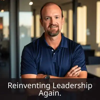 Jim Rembach standing confidently in a modern office space with arms crossed, wearing business casual, overlaid with the text ‘Reinventing Leadership Again,’ reflecting his role in transforming leadership development with digital systems and AI.