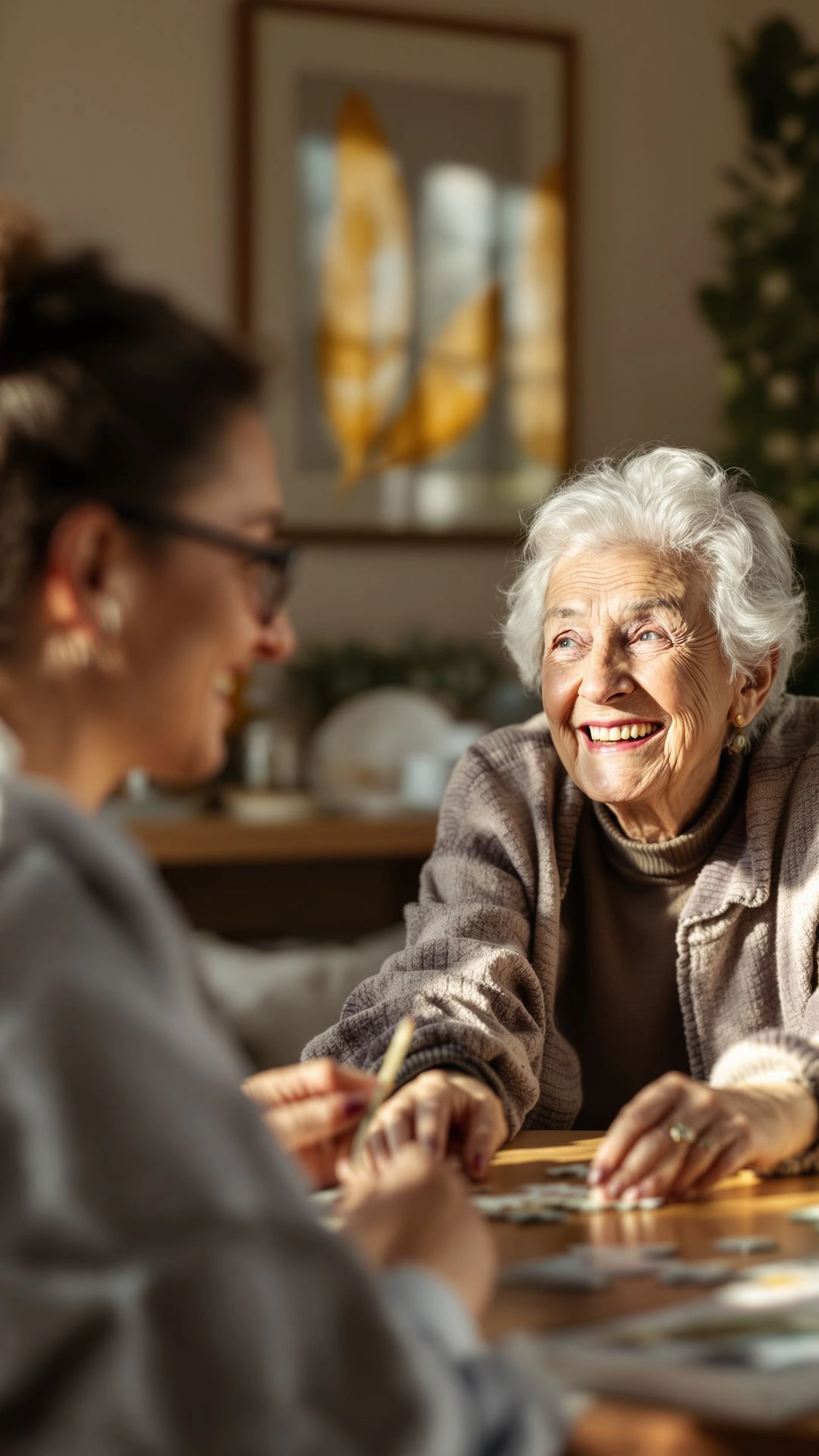 Senior doing a puzzle with a caregiver in a calm, well-lit room, supporting emotional and cognitive well-being.
