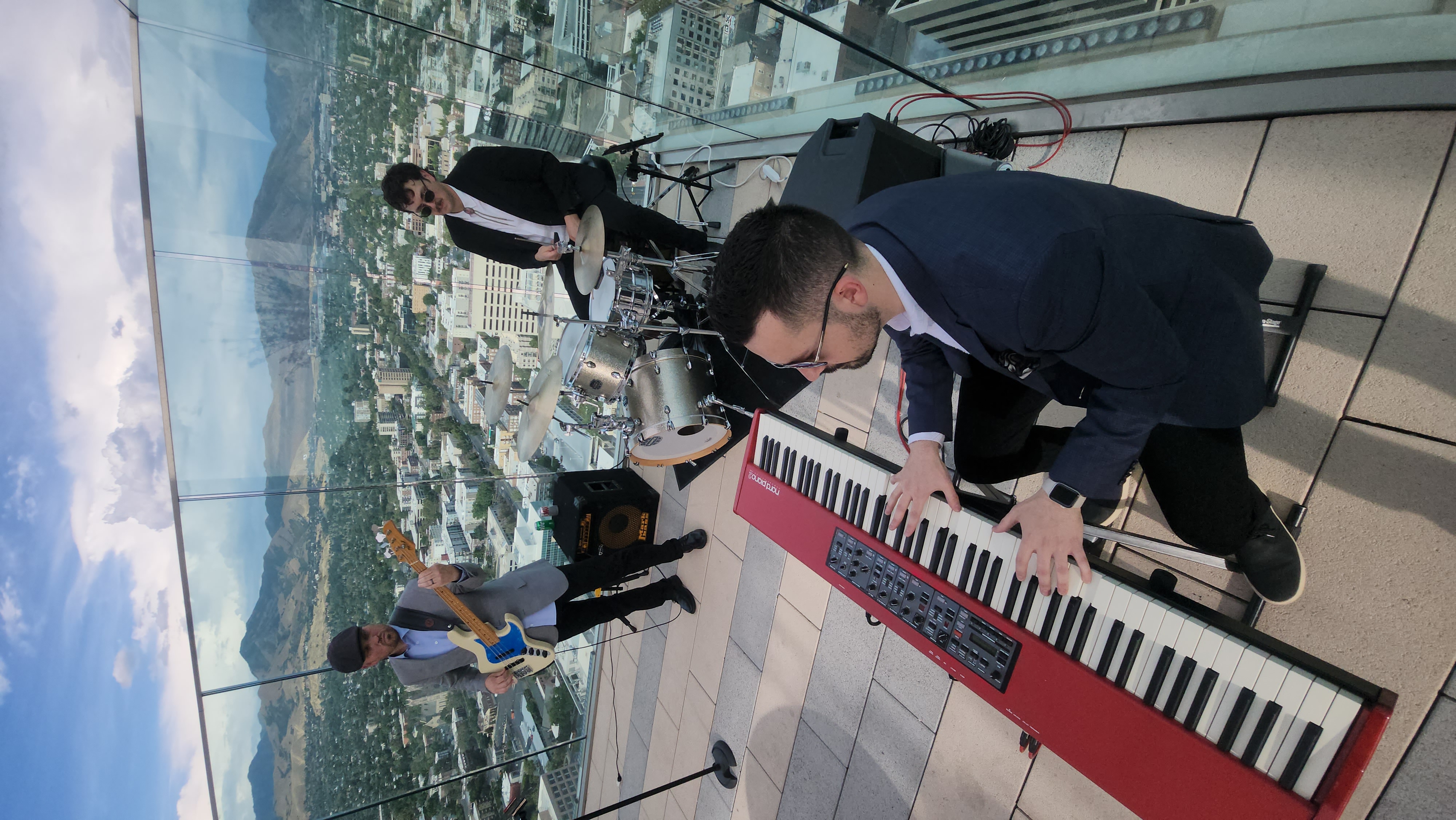 Kevin Judd Trio performing live jazz at a rooftop cocktail event